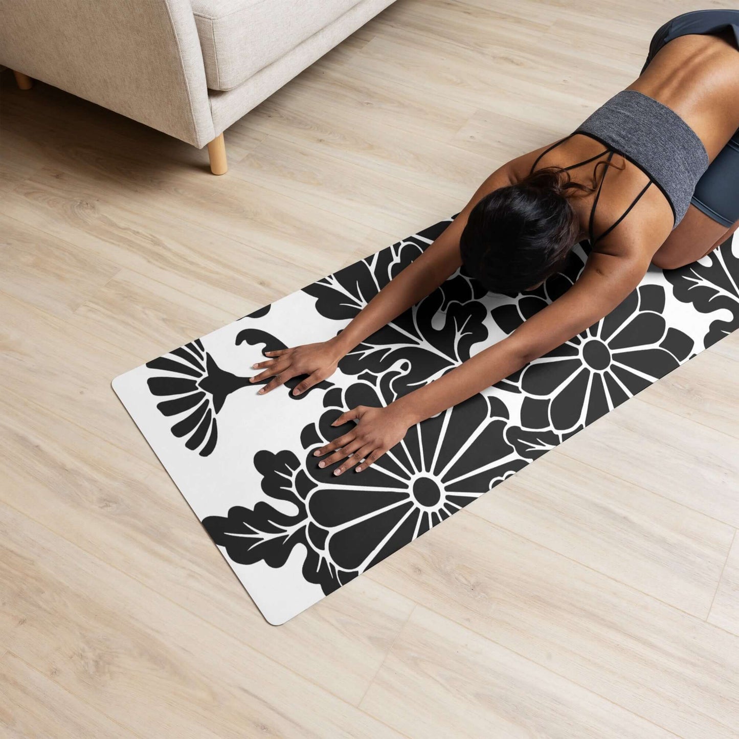 Person practicing yoga on Yoga-Matte N°0 with non-slip rubber bottom and soft microvelours top, floral design. Size 61 cm × 173 cm.
