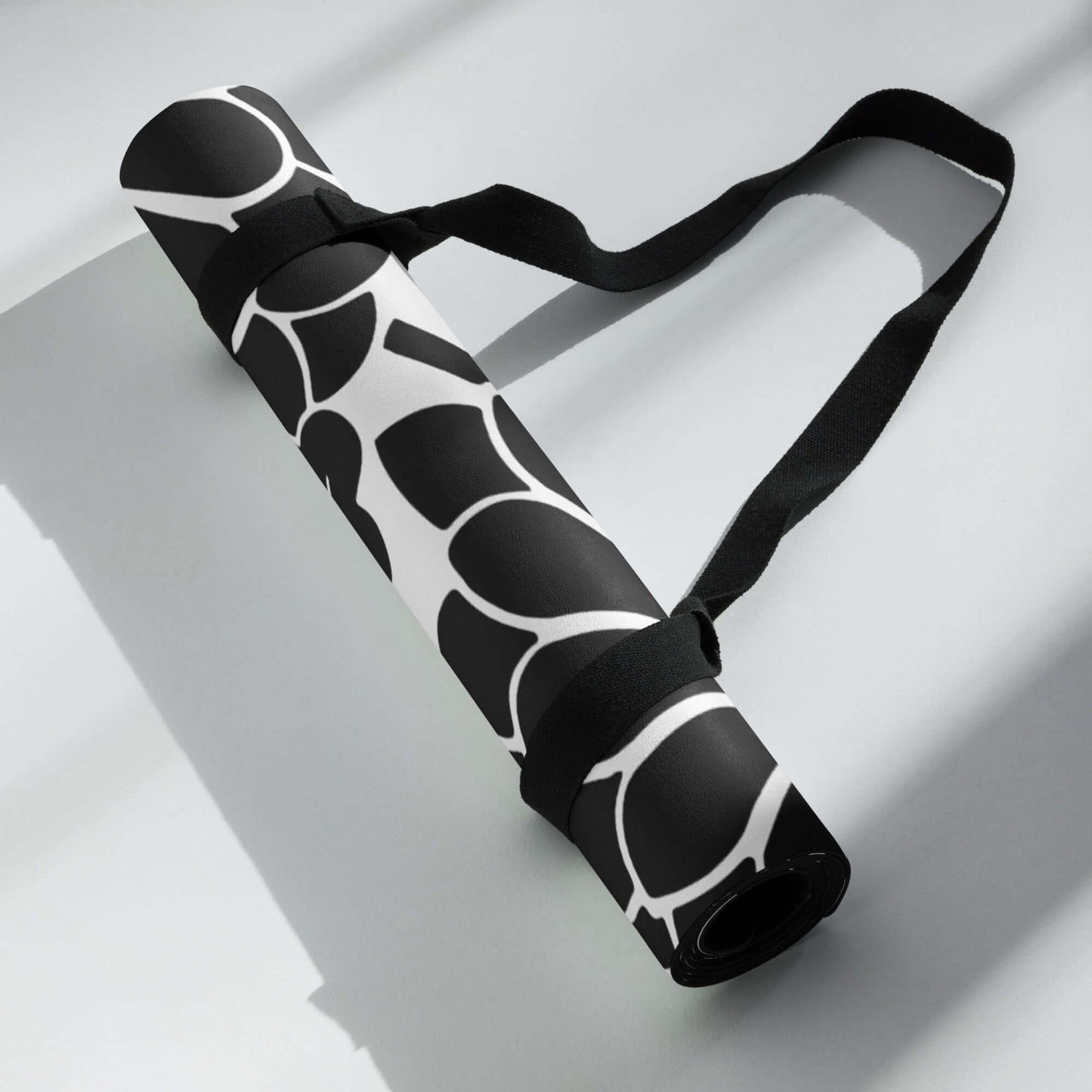 Yoga-Matte N°0 with stylish pattern and strap, ideal for yoga, stretching, and meditation, offering stability and comfort.