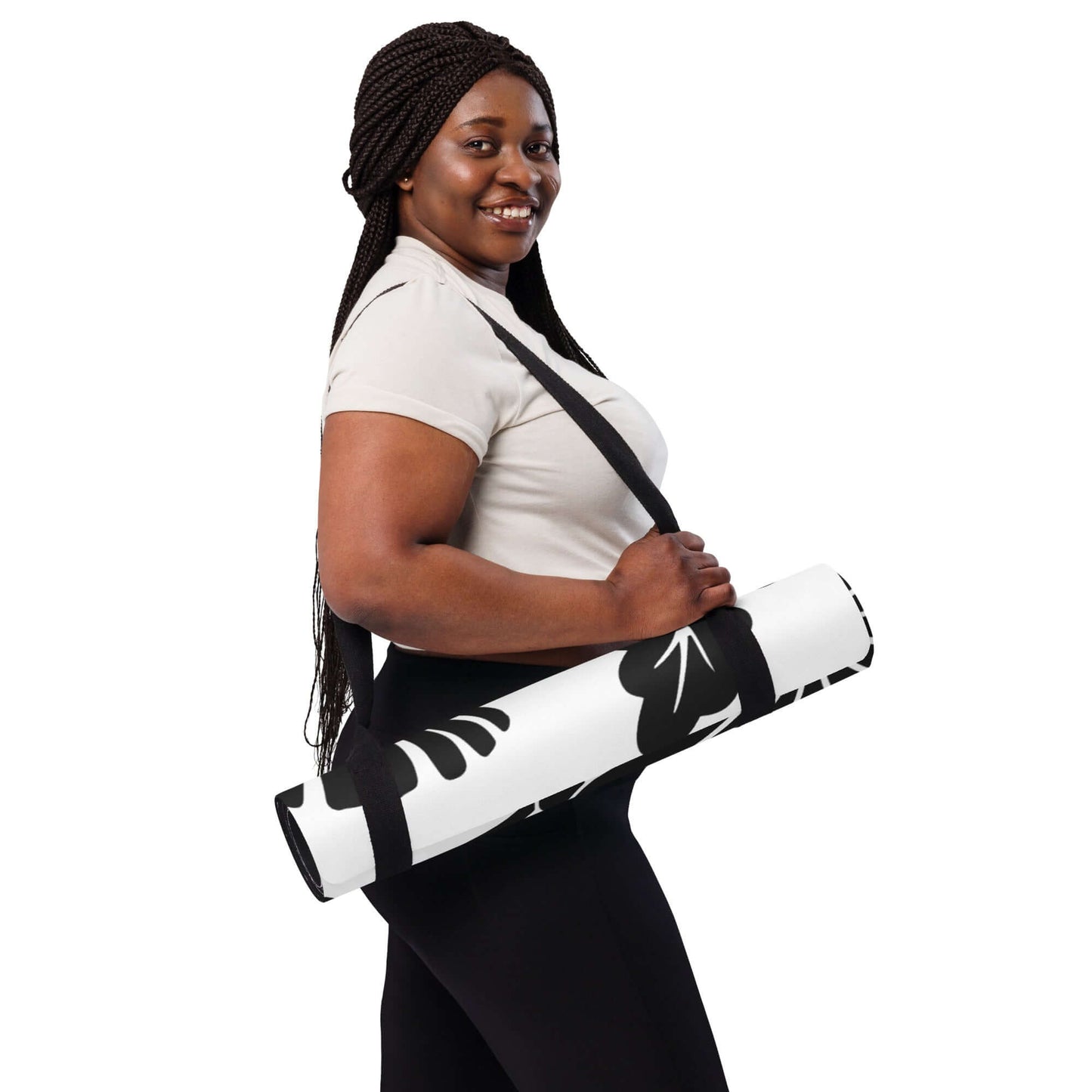 Person carrying Yoga-Matte N°0 with stylish design, showcasing easy transport and comfort for workouts and meditation.