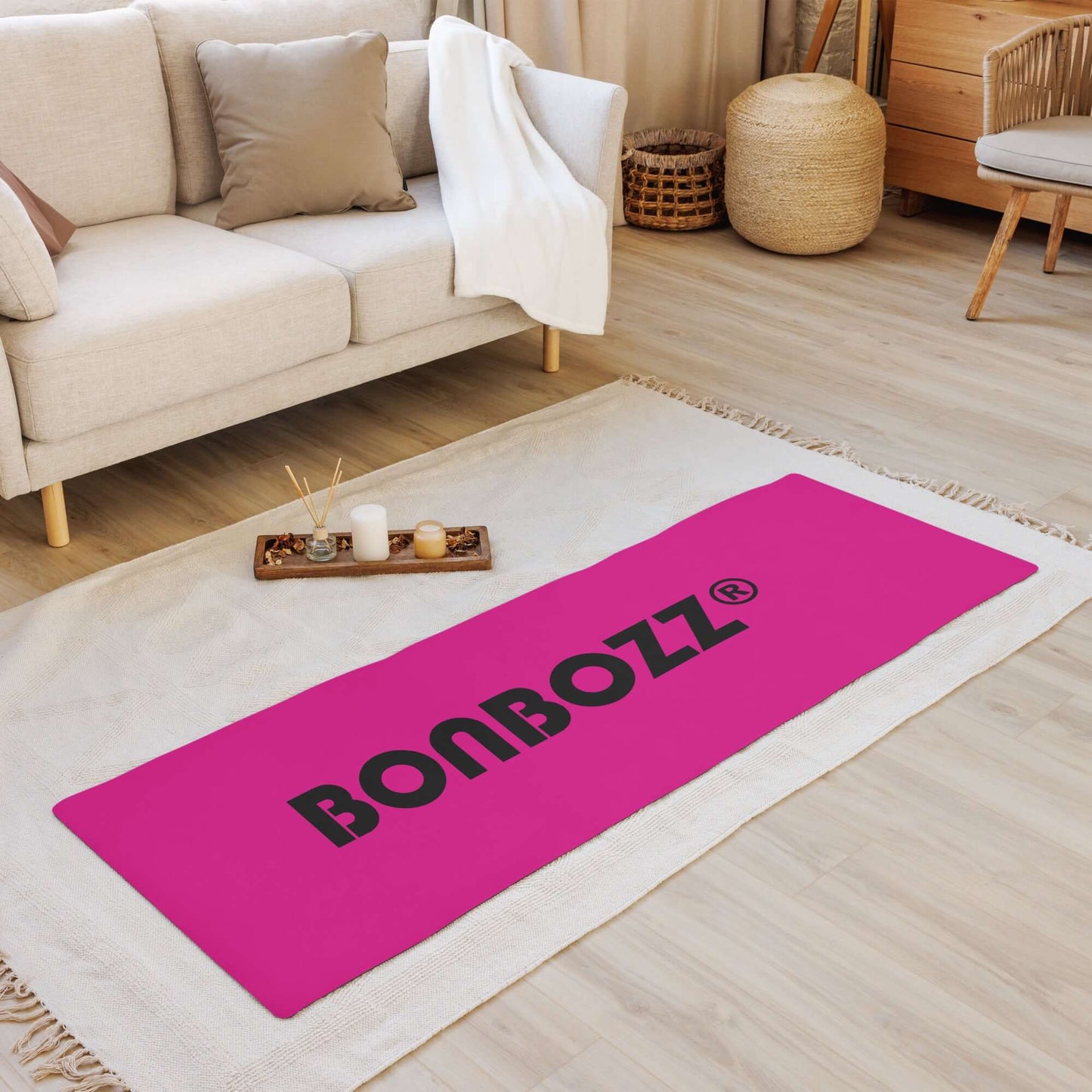 Yoga-Matte N°1 with pink design, soft microsuede top, and non-slip rubber bottom, displayed in a cozy living room setting.