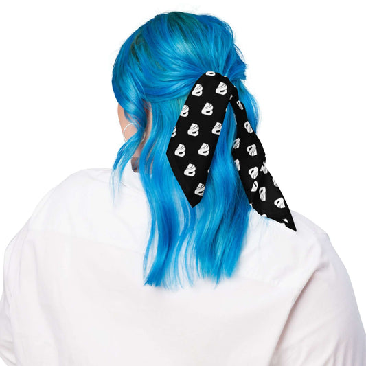 Person with blue hair wearing Bandana N°0, black with white pattern, styled as a hair accessory.