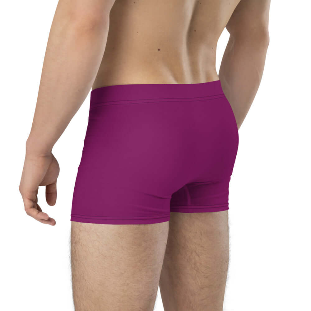 Back view of a man wearing Boxer-Briefs N°5 in purple, showcasing no back seam and soft elastic waistband for comfort and support.