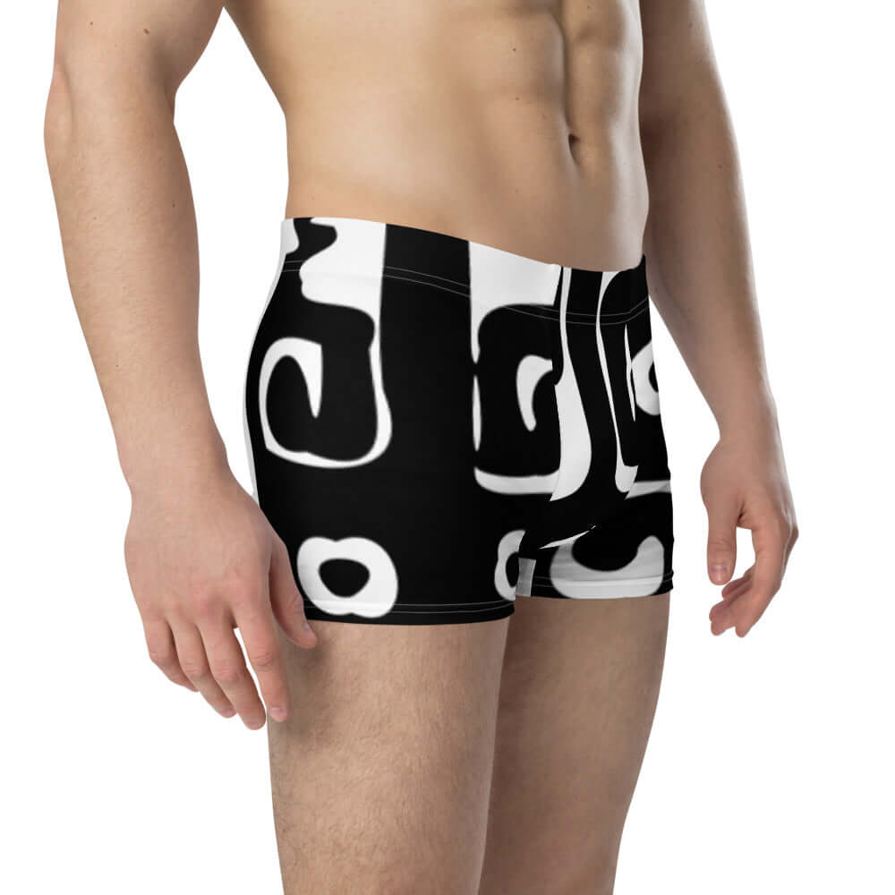 Boxer-Briefs N°8 in black and white, designed for comfort with soft stretchy material and no rear seam, shown on male model.