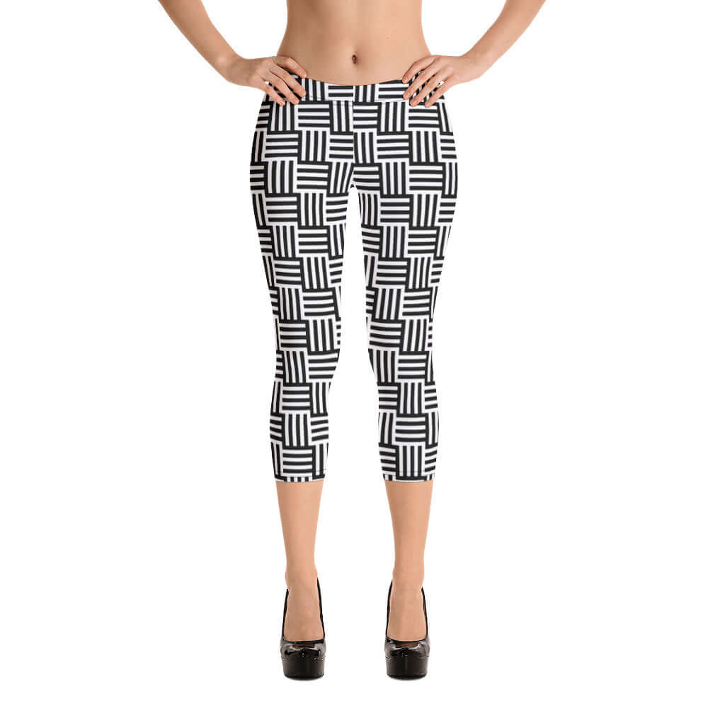 Woman wearing Capri-Leggings N°1 with black and white geometric pattern, showcasing comfortable fit and four-way stretch.