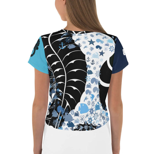 Woman wearing Crop-T-Shirt N°0 with unique allover design, showcasing a blend of blue, black, and white patterns, perfect for stylish outfits.