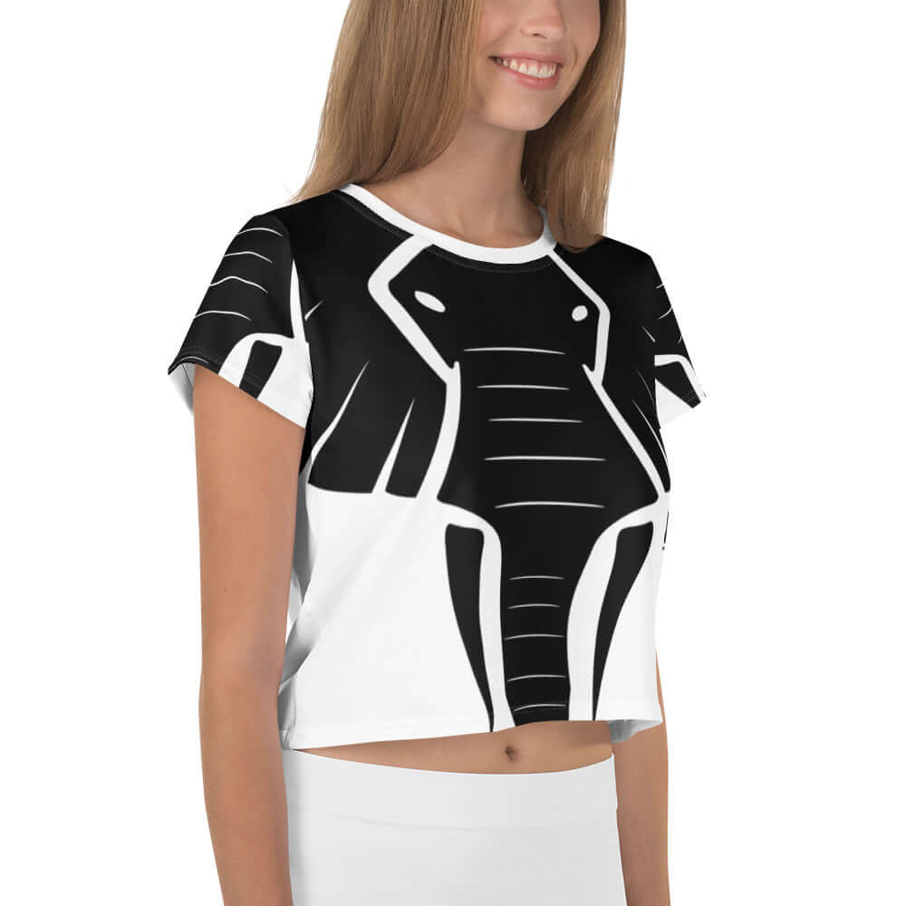 Woman wearing Allover-Crop-T-Shirt N°0 with black elephant design, showcasing stylish casual wear.