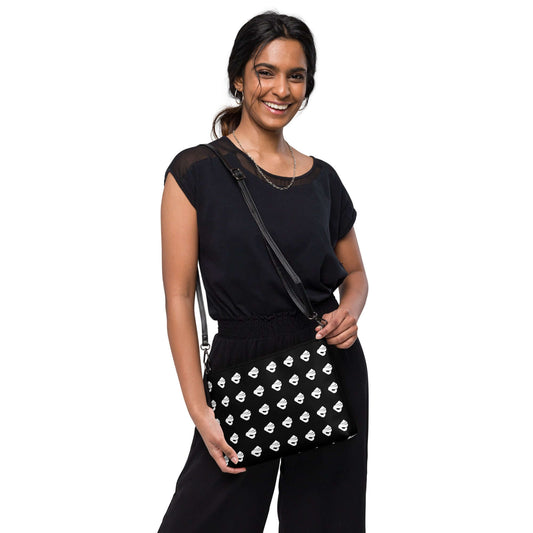 Woman with Umhängetasche N°0 in black outfit, smiling and showcasing stylish shoulder bag with dark gray hardware, versatile for any occasion.
