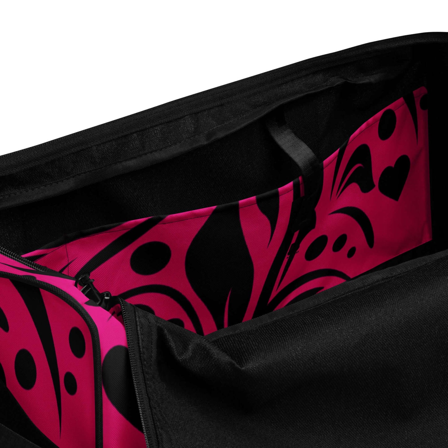 Interior view of Weekender N°15 showing spacious pockets with vibrant pink and black design, ideal for travel and gym essentials.