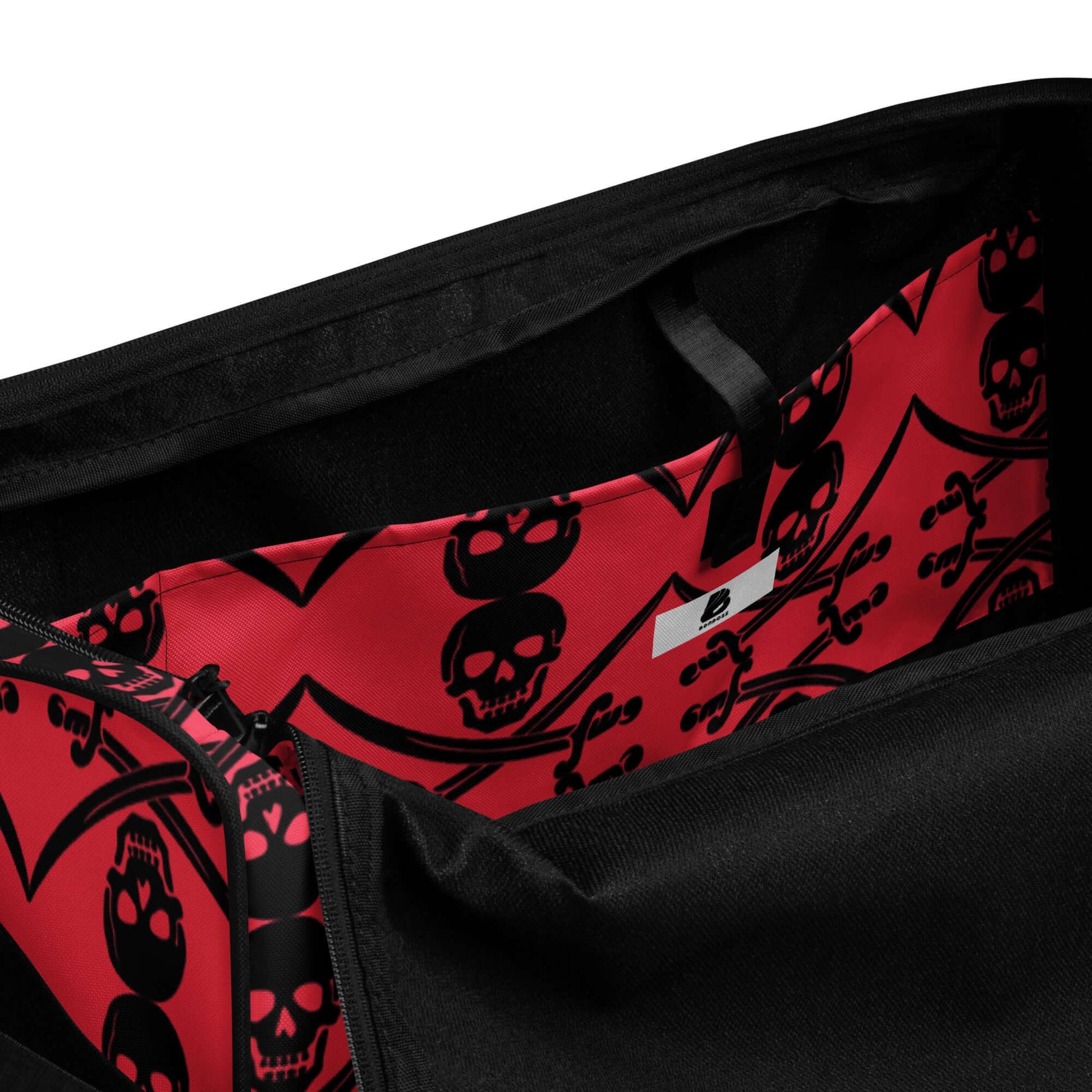 Interior view of Weekender N°16 bag showing red skull patterned lining and spacious compartments for organization and storage.