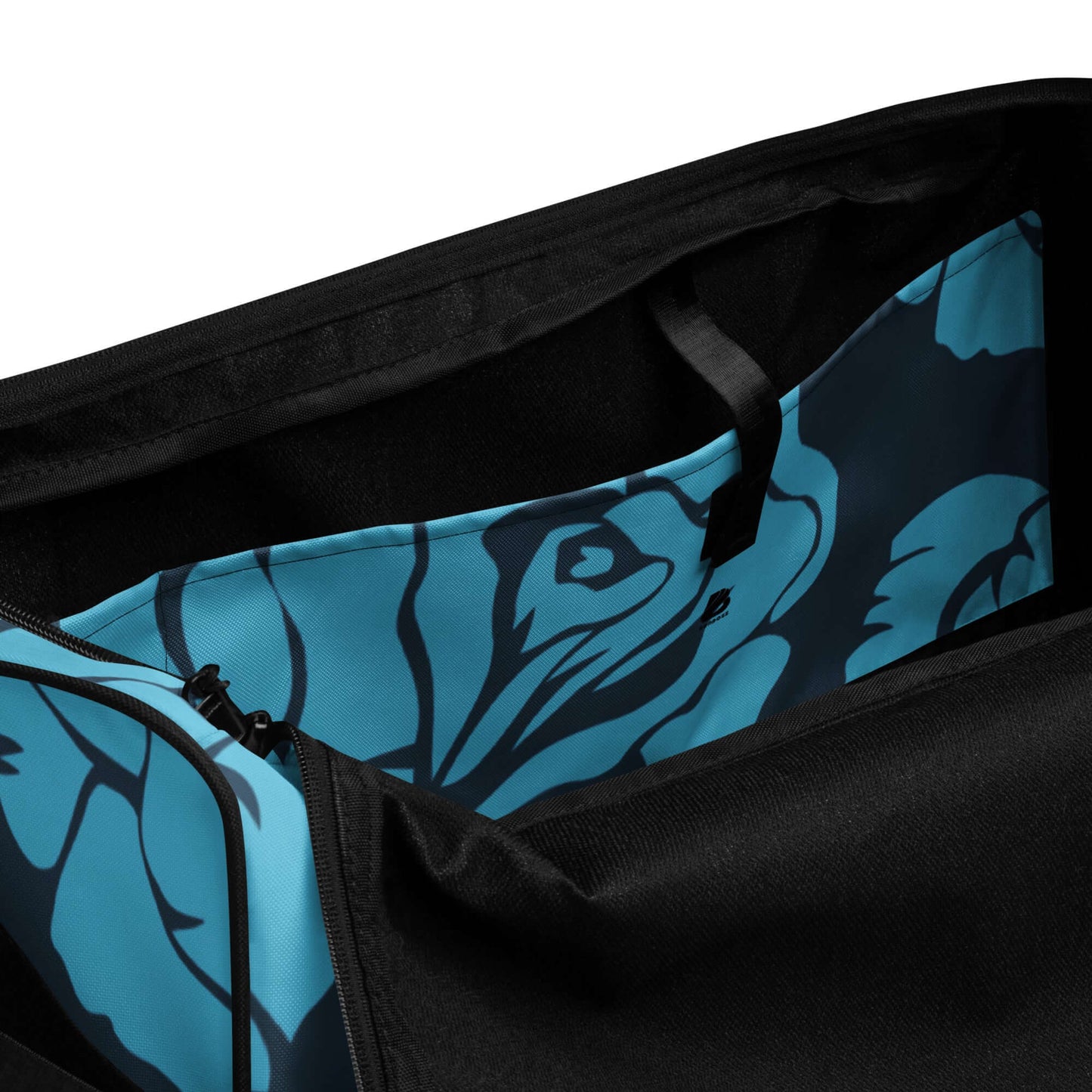 Interior view of Weekender N°19 showing spacious compartments and zipper pocket with stylish blue floral design lining.