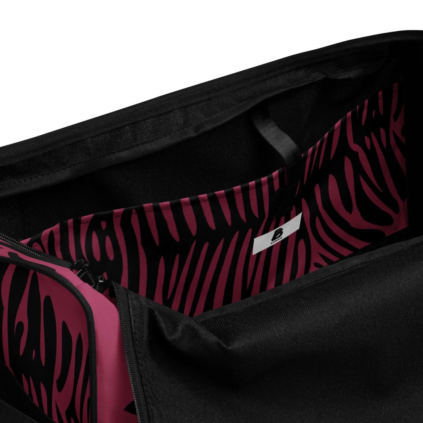 Interior view of Weekender N°23 showing spacious design with pink zebra print lining and secure zip pocket for valuables.