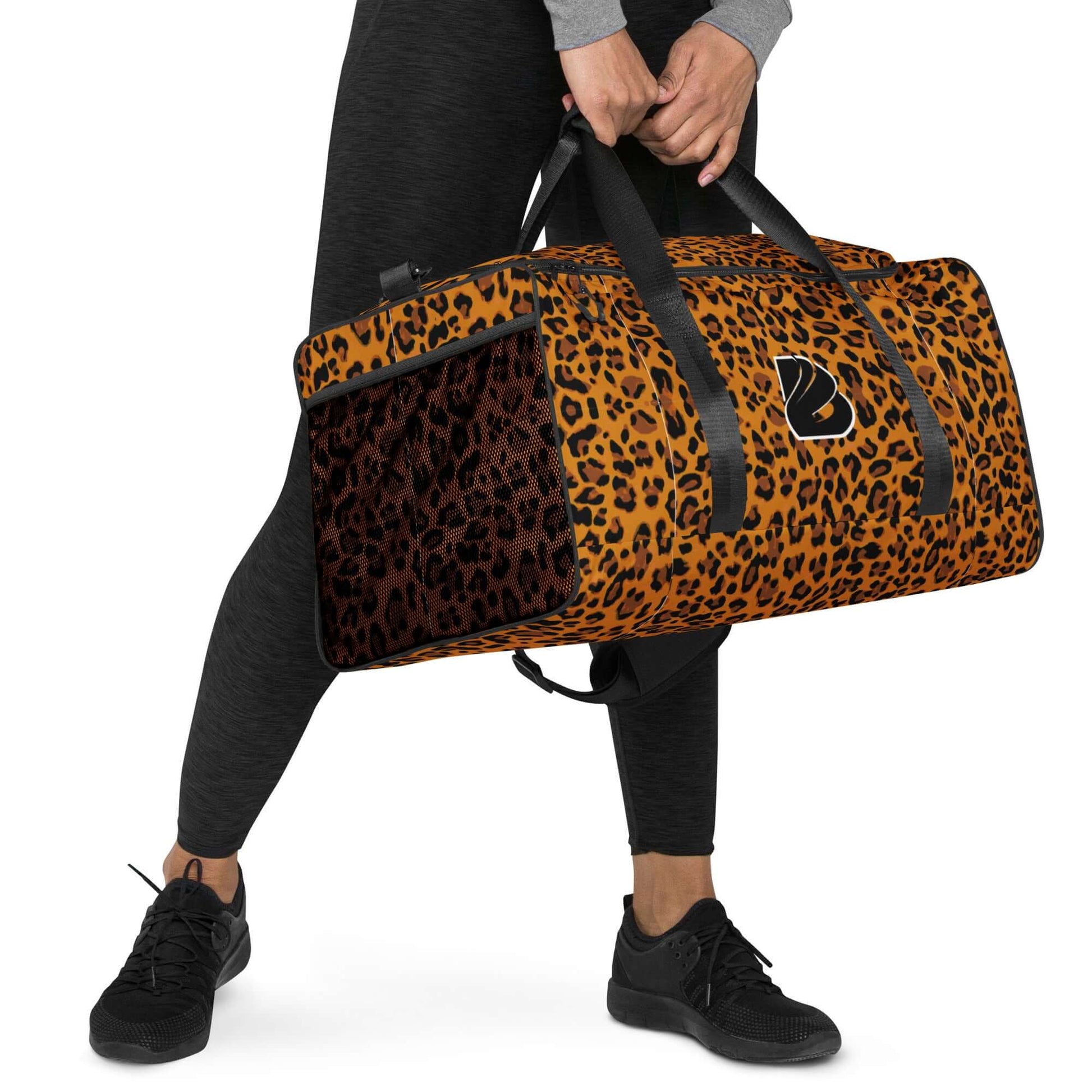 Person carrying leopard print Weekender N°20 bag with adjustable padded straps, perfect for travel, gym, or errands.