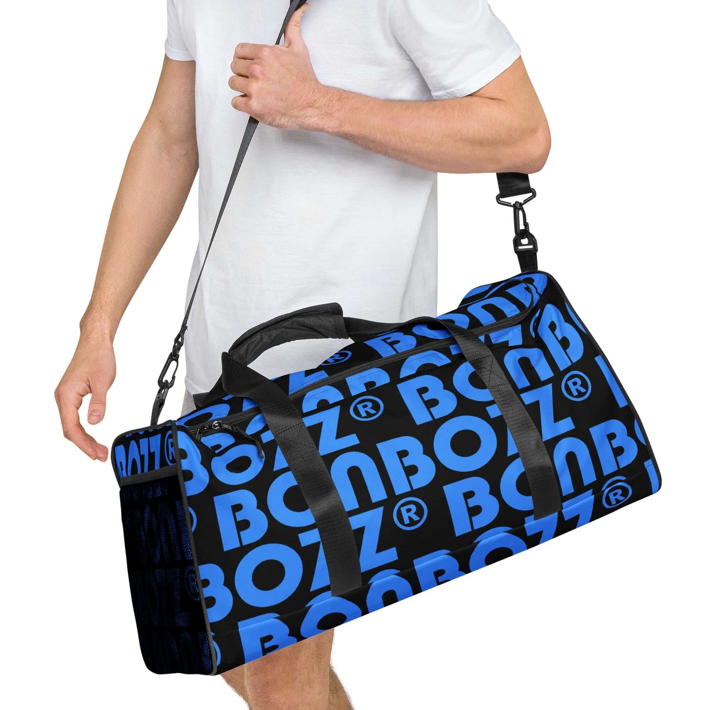 Man carrying Weekender N°25 in blue with BOZZ branding, perfect for travel, daily use, or gym with adjustable padded shoulder straps.