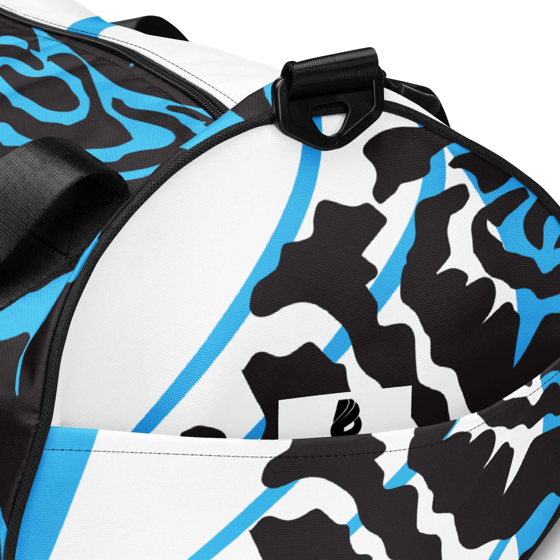 Allover-Print-Sporttasche N°4 with blue and black abstract design, featuring durable waterproof polyester material and additional pockets.