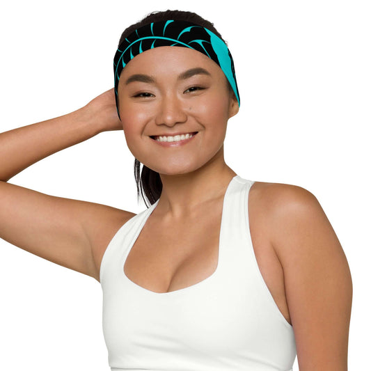 Woman wearing Stirnband N°1, stylish and stretchy athletic headband in blue and black, providing comfort for workouts or casual wear.
