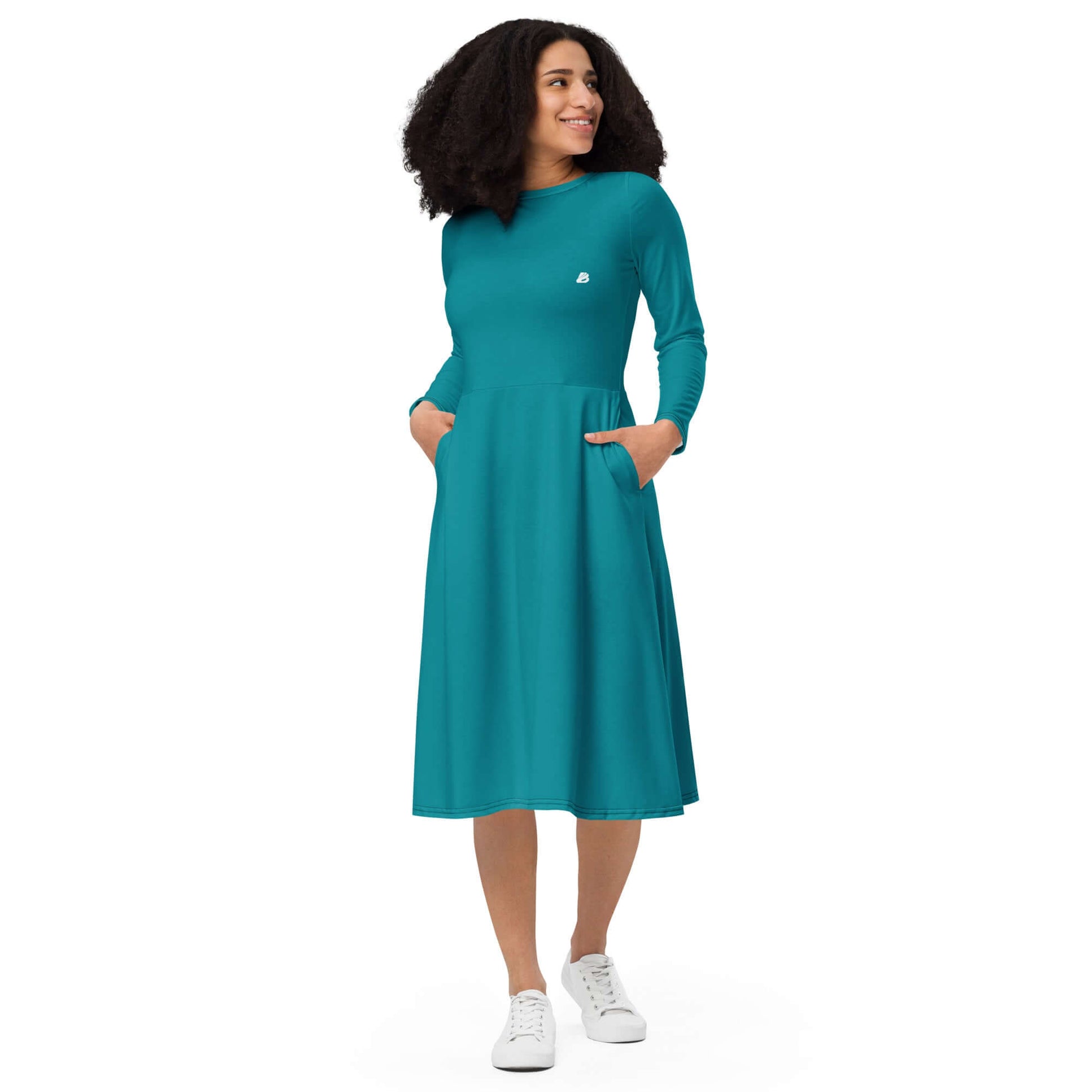 Woman wearing Langärmliges Midikleid mit Allover-Druck N°3 in teal with side pockets, showing flattering fit and silhouette.