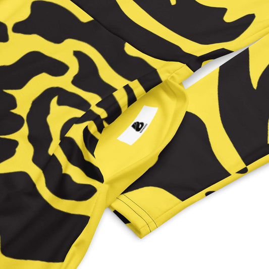 Close-up of yellow and black patterned fabric of langärmliges Midikleid N°2 showcasing the design and texture.