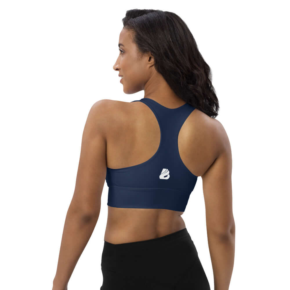 Model wearing Longline-Sport-BH N°0 in navy, showing back view and racerback design for activewear and styling flexibility.