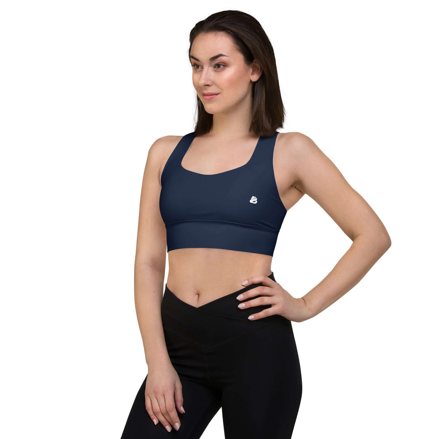 Woman wearing Longline-Sport-BH N°4, perfect for jogging or streetwear. Supportive design in dark blue, emphasizes comfort and style.