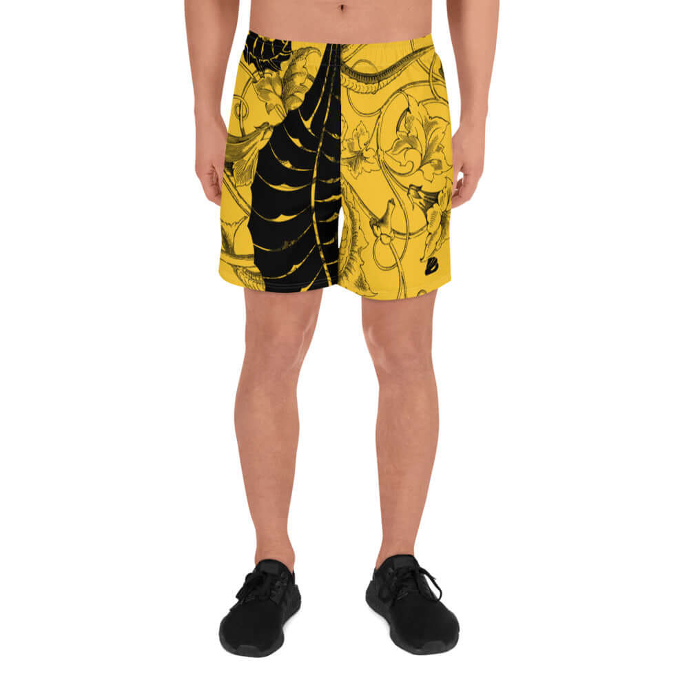 Lange Sport-Shorts für Herren N°0 with black and yellow patterned design, ideal for running and fitness activities.