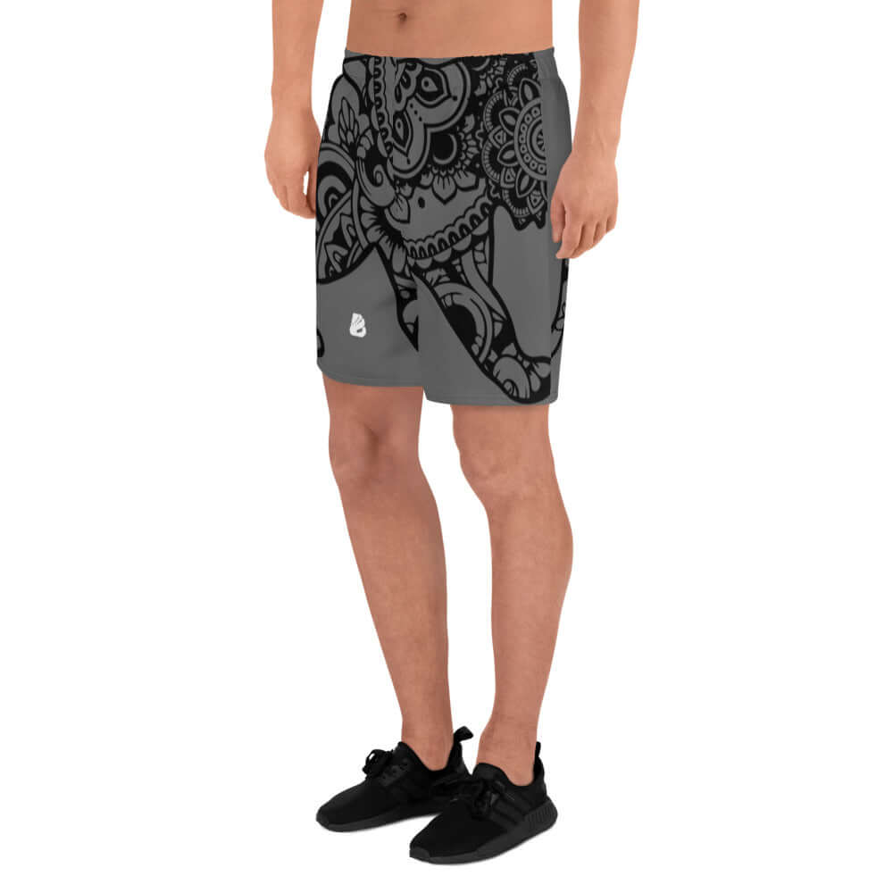 Lange Allover-Sport-Shorts für Herren N°2 with black abstract design, suitable for running and workouts, shown on male model