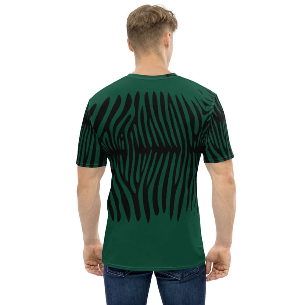 Person wearing Herren-T-Shirt N°1 with black and green abstract design, showcasing back view, made of premium knit fabric, comfortable fit.