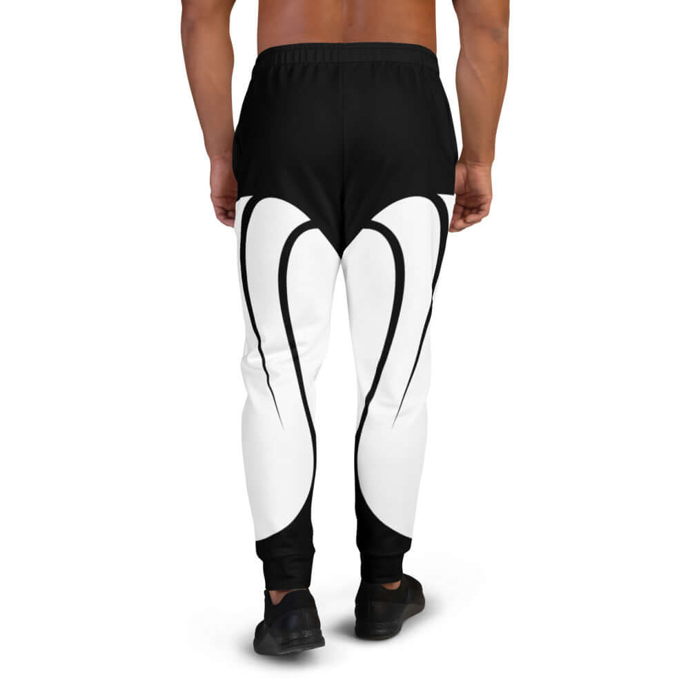 Back view of Herren-Jogginghose N°0 in black and white design, perfect for jogging or lounging, made of polyester-cotton blend.