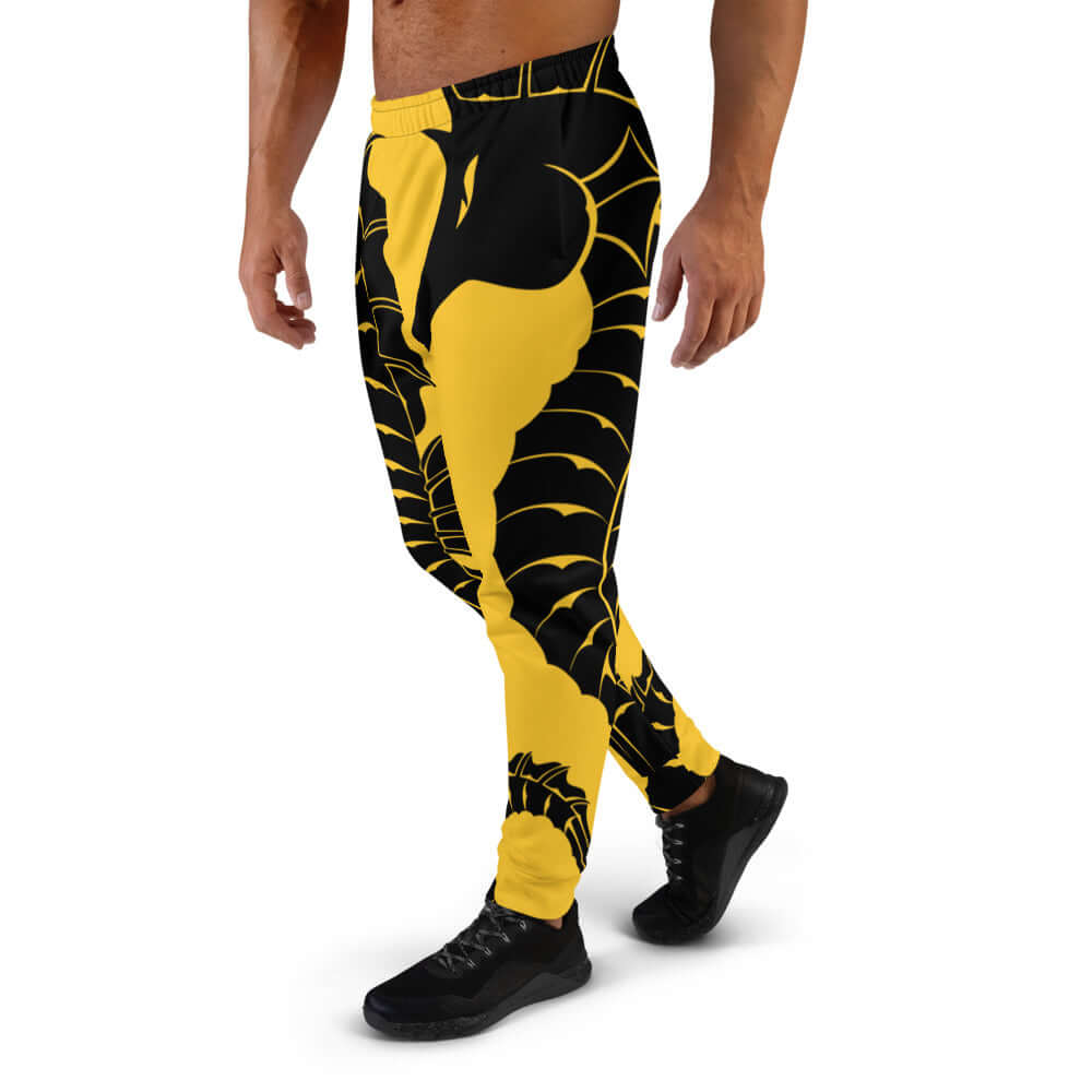 Model wearing Herren-Jogginghose N°2 with black and yellow design, perfect for jogging or relaxing. Comfortable cotton blend.