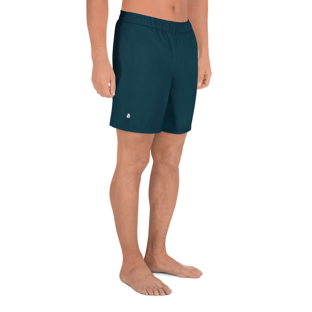 Man wearing Recycelte Sport-Shorts für Herren N°0 in dark color, showcasing athletic fit and comfort, ideal for gym or swim activities.