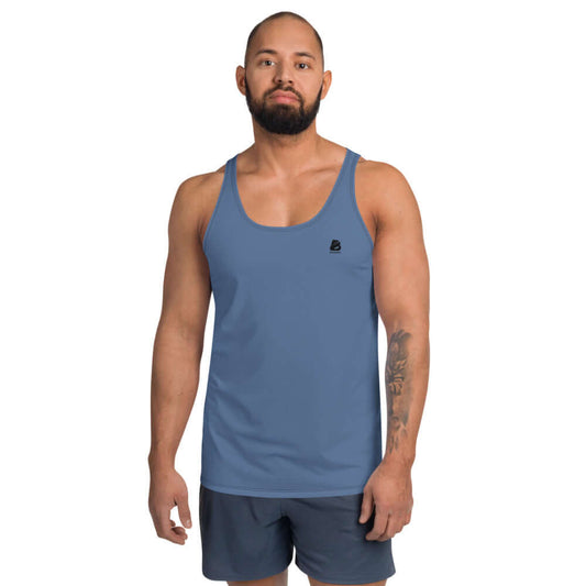 Unisex Tank-Top N°1 in blue worn by a male model, showcasing soft, stretchy fabric and relaxed fit for a stylish look.