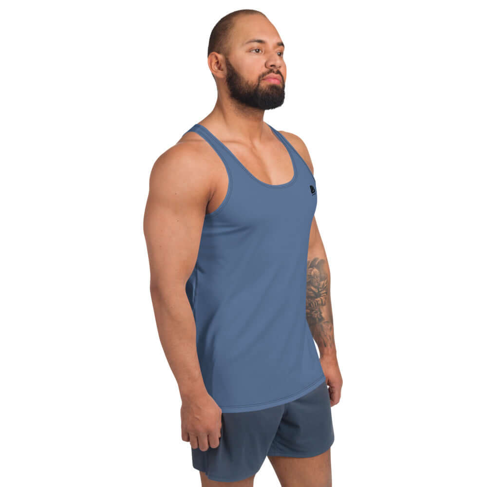 Model wearing Unisex Tank-Top N°1 in blue, showcasing vibrant color and relaxed fit.