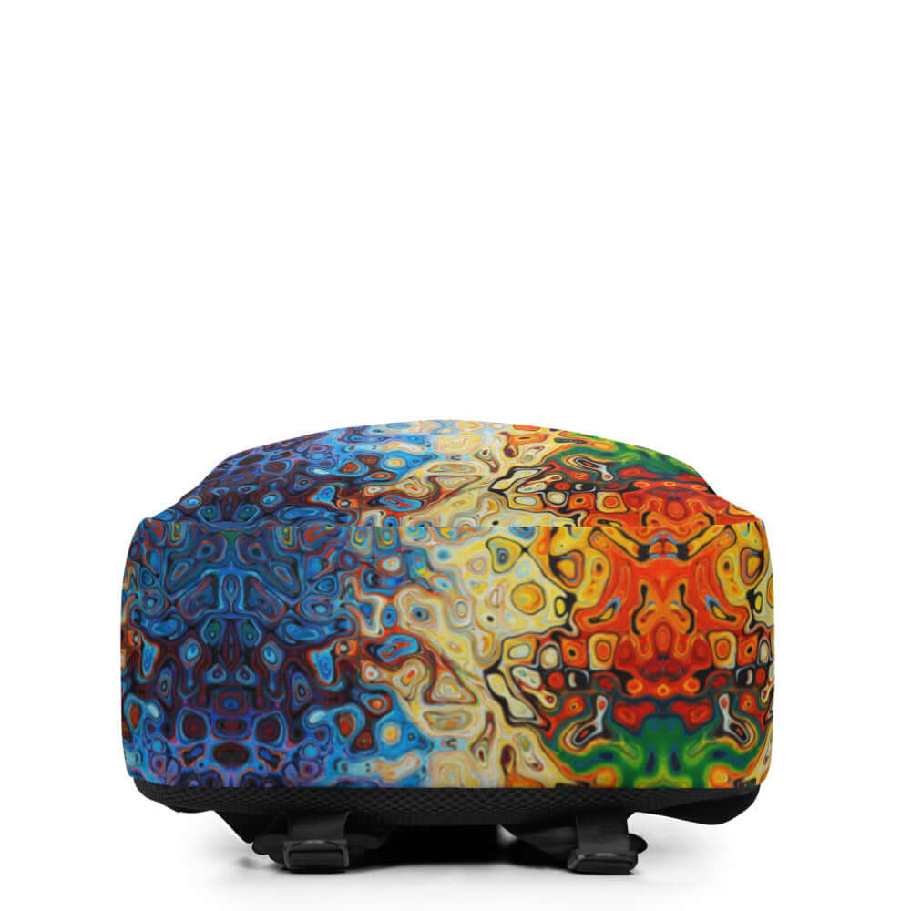 Colorful abstract design on backpack base viewed from front angle.