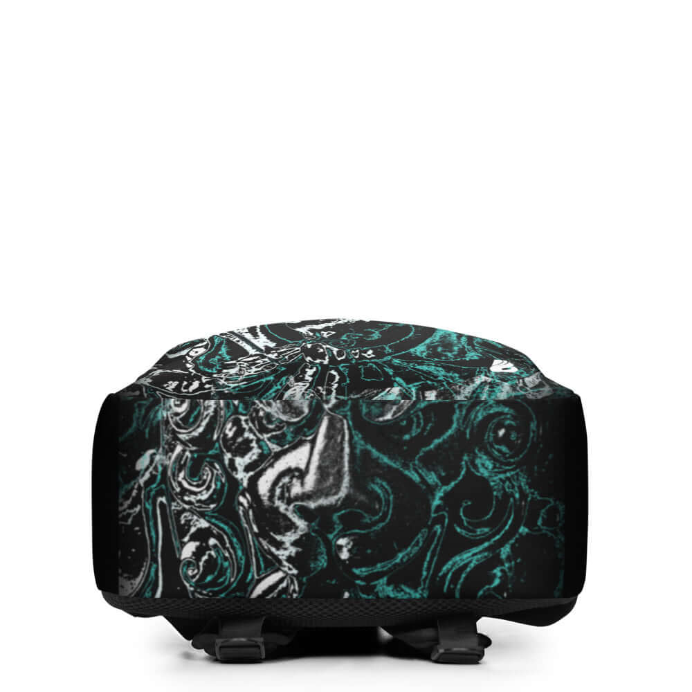 Minimalistischer Rucksack N°9 with artistic black and teal design, showing bottom view with sturdy straps and hidden compartment.