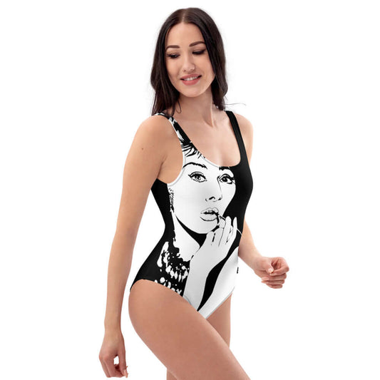 Model wearing Einteiliger Badeanzug N°3 with graphic design, flattering fit, U-neckline, suitable for beach or pool.