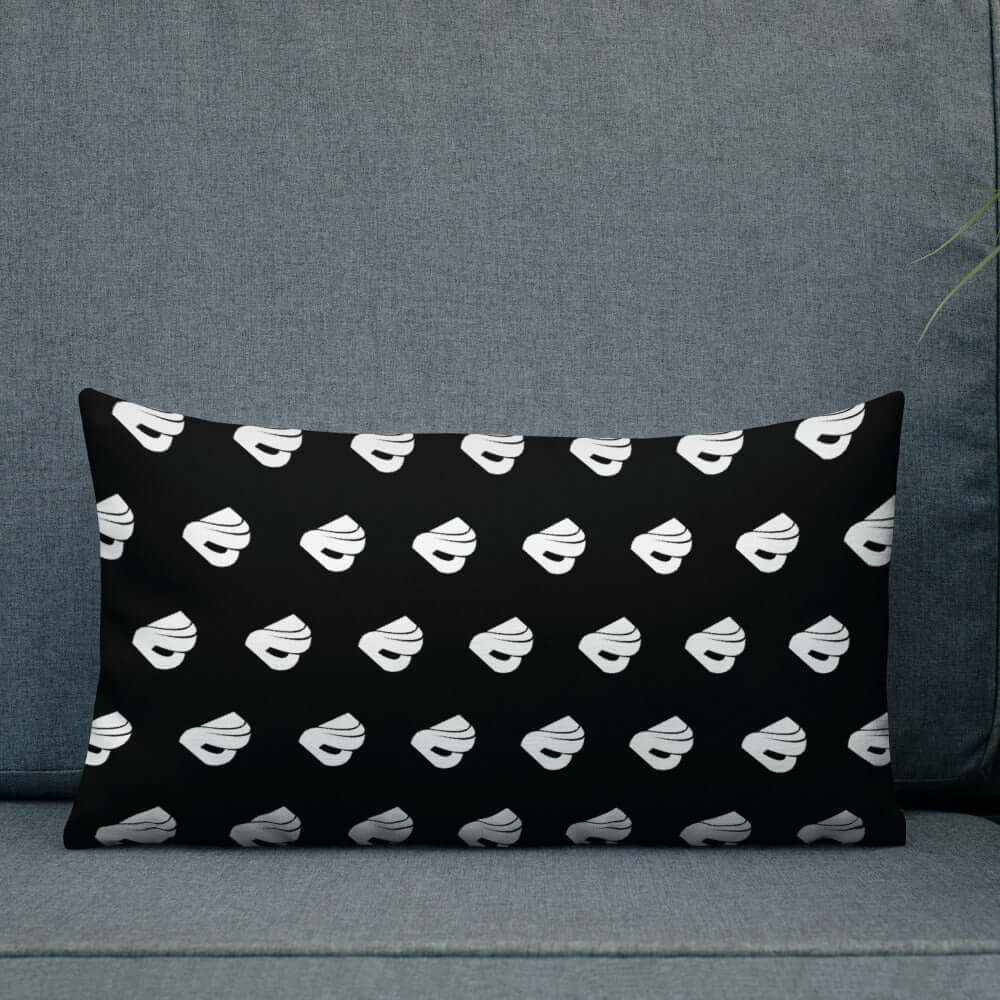 Black and white patterned Premium-Kissen N°0 on a grey sofa, enhancing room luxury with its modern design and durable polyester cover.