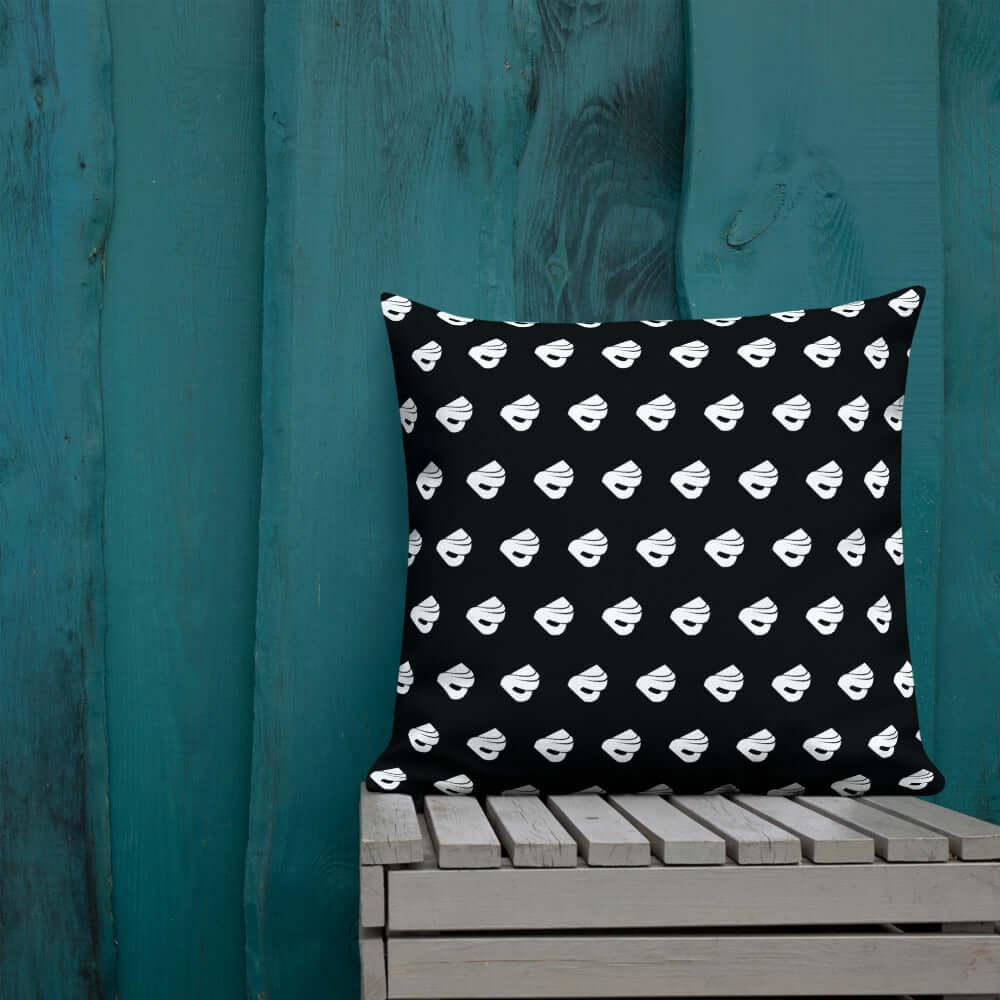 Premium-Kissen N°0 on wooden bench with black and white design, adding elegance and color to any room, featuring washable cover.