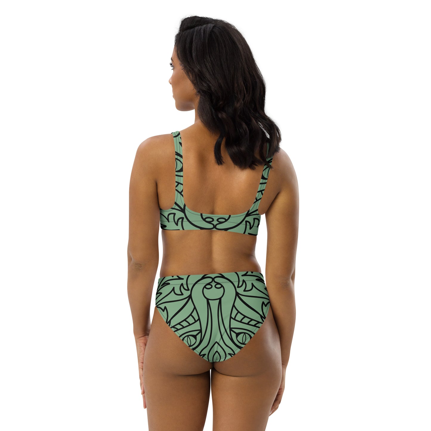 Woman wearing the Recycelter Allover High Waist Bikini N°0 in green patterned design from the back.