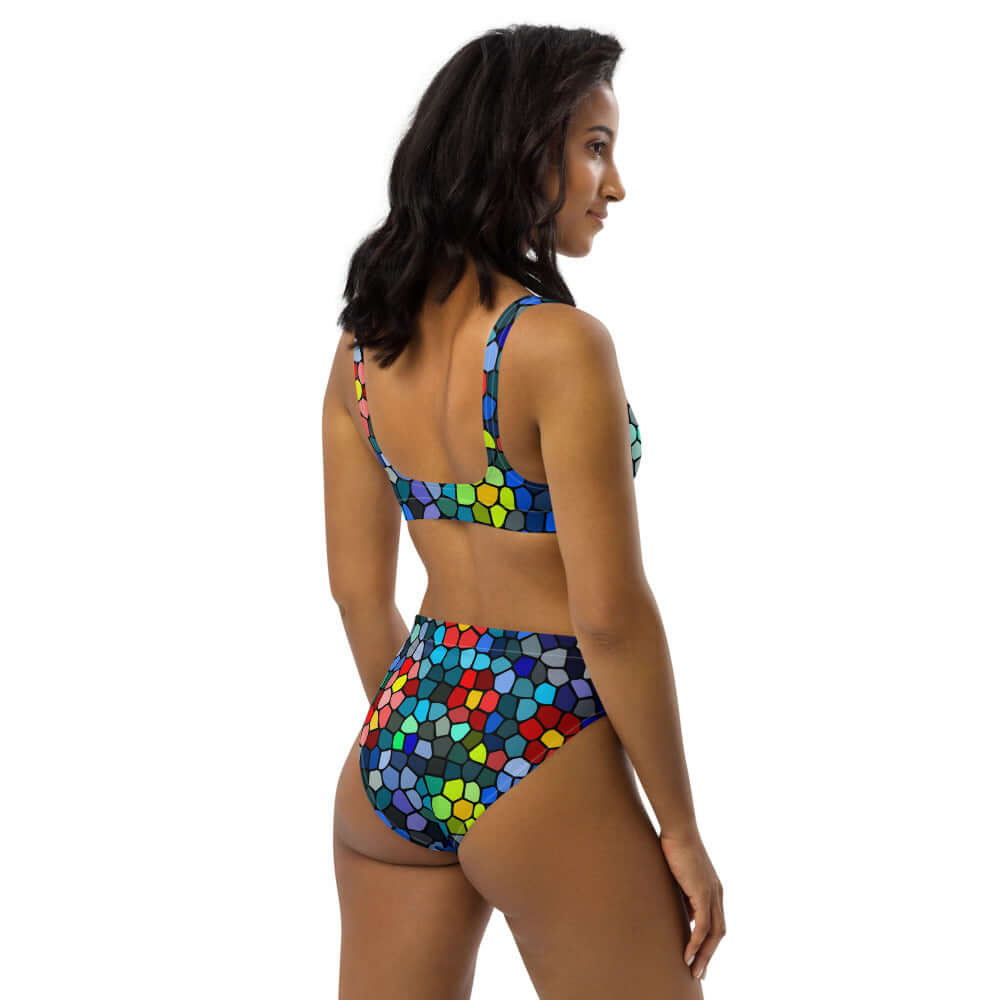 Woman wearing colorful High Waist Bikini N°0 with a geometric pattern and high-rise fit, ideal for beach or pool days.