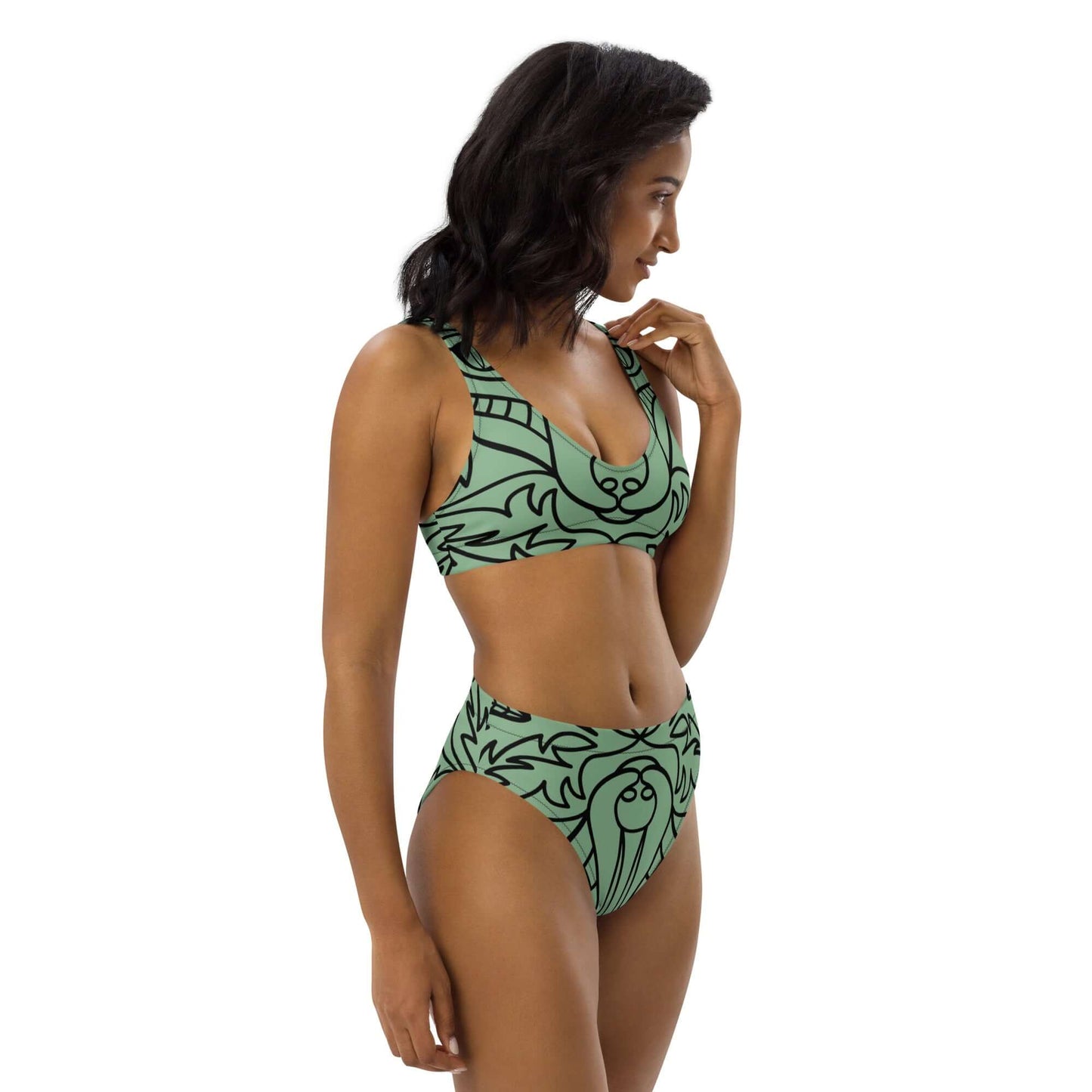 Woman wearing Recycelter Allover High Waist Bikini N°0 with green abstract pattern, featuring high-waist design and comfortable fit.