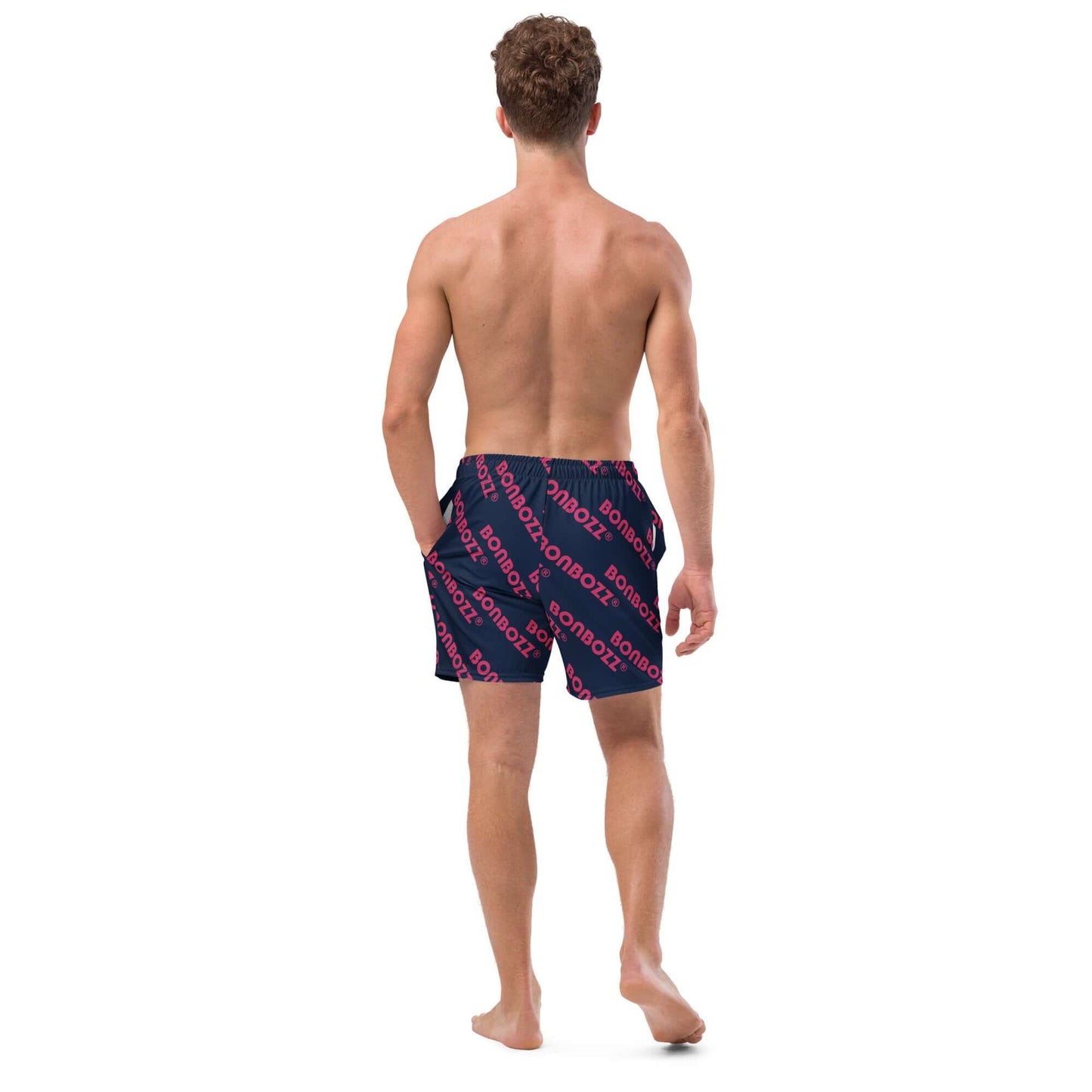Man wearing Herren-Badehosen N°9 swim trunks with breathable fabric and multiple pockets, navy and red design, viewed from the back.