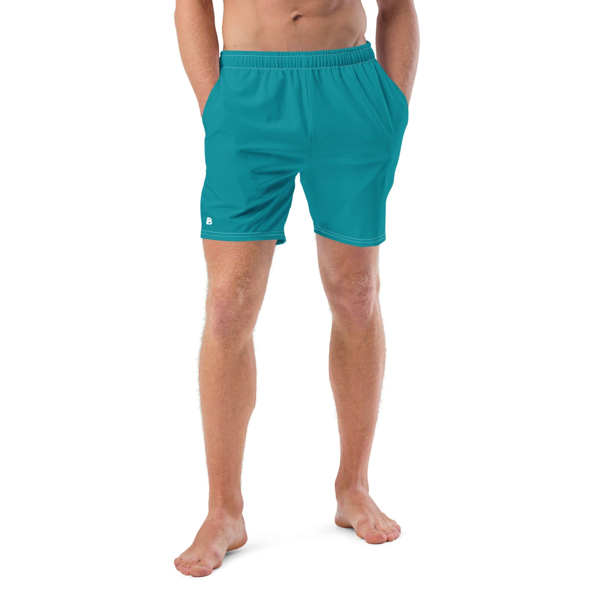 Man wearing Herren-Badehosen N°10, quick-dry, breathable swim trunks with pockets, showcasing stretch and comfort for summer.