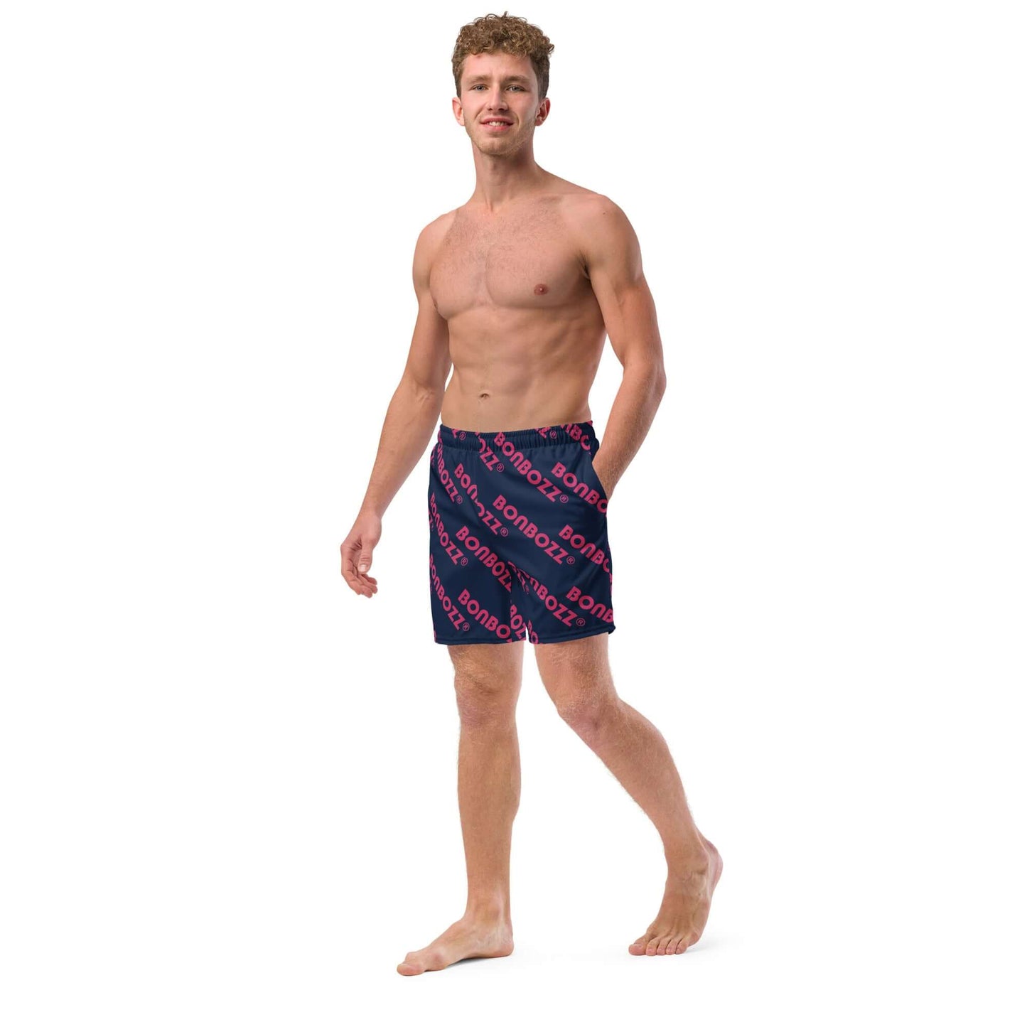 Man wearing Herren-Badehosen N°9 swimming shorts with navy and red design, ideal for summer activities, shown against a white background.