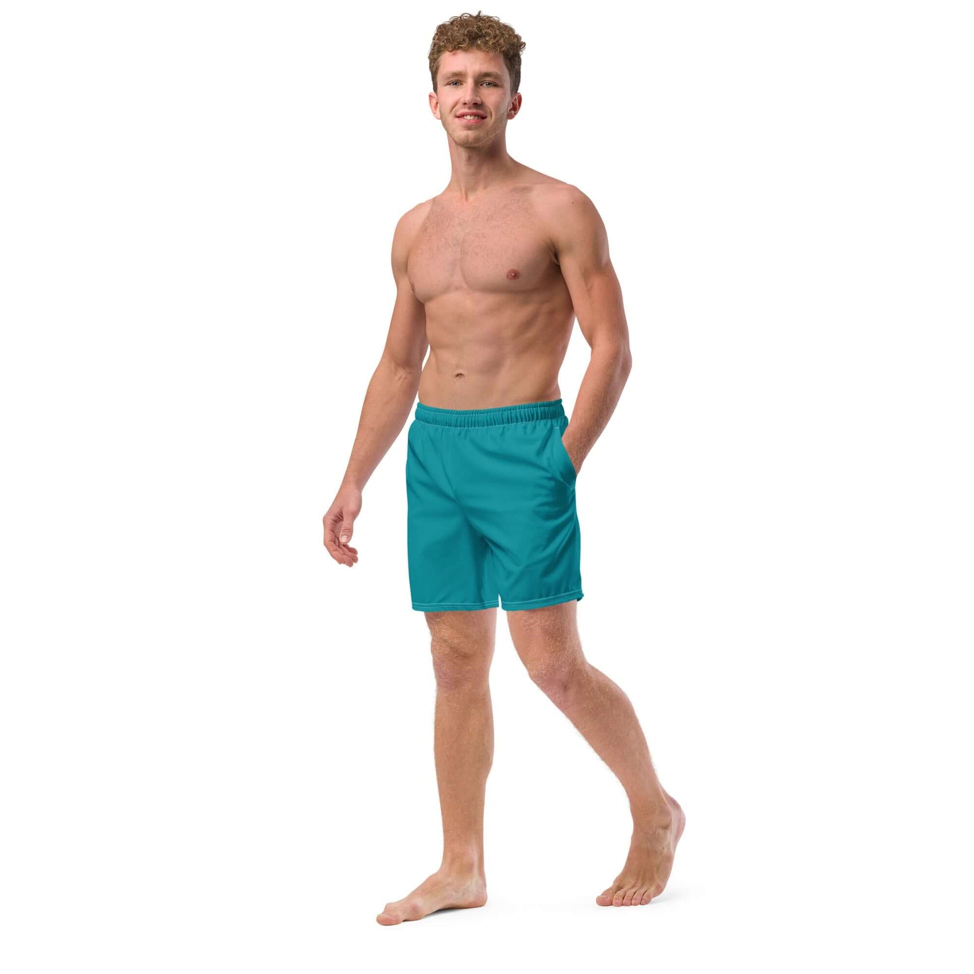 Man wearing Herren-Badehosen N°10 in teal, quick-drying and breathable swim trunks, perfect for summer days.