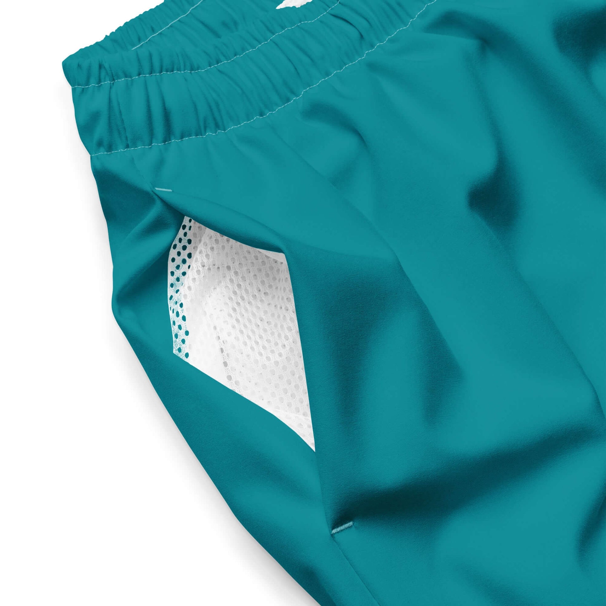 Close-up of Herren-Badehosen N°10 showcasing breathable mesh lining and teal color fabric.