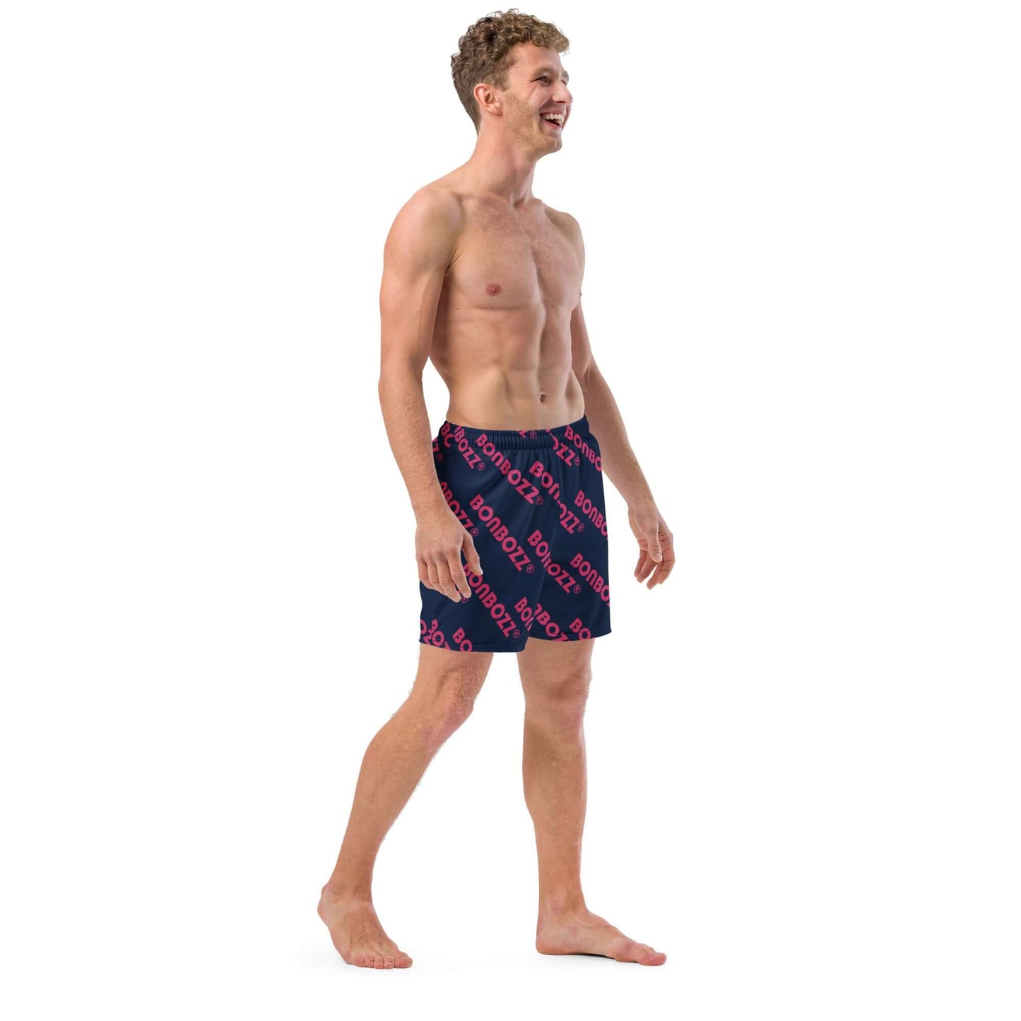 Man wearing Herren-Badehosen N°9 swim shorts, featuring quick-dry and breathable fabric with pockets, perfect for summer.