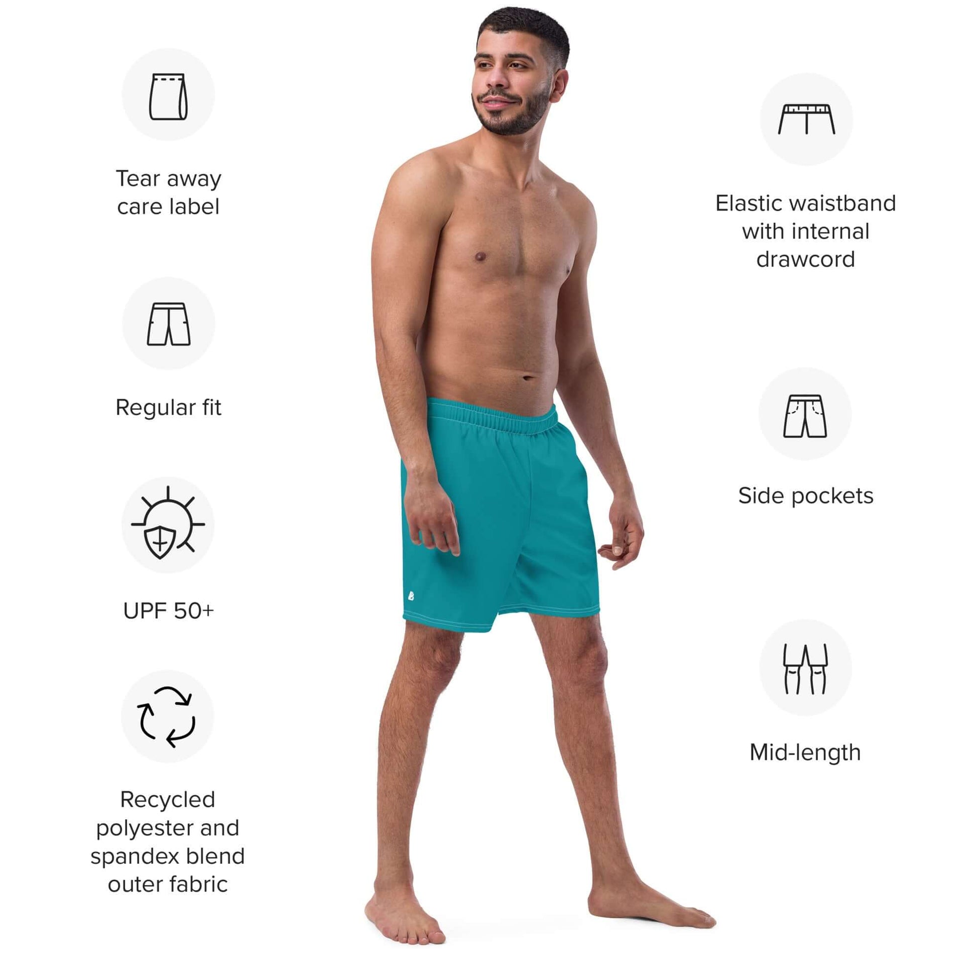 Man wearing Herren-Badehosen N°10, stylish teal swim shorts with elastic waistband and side pockets, ideal for summer, quick-dry fabric.