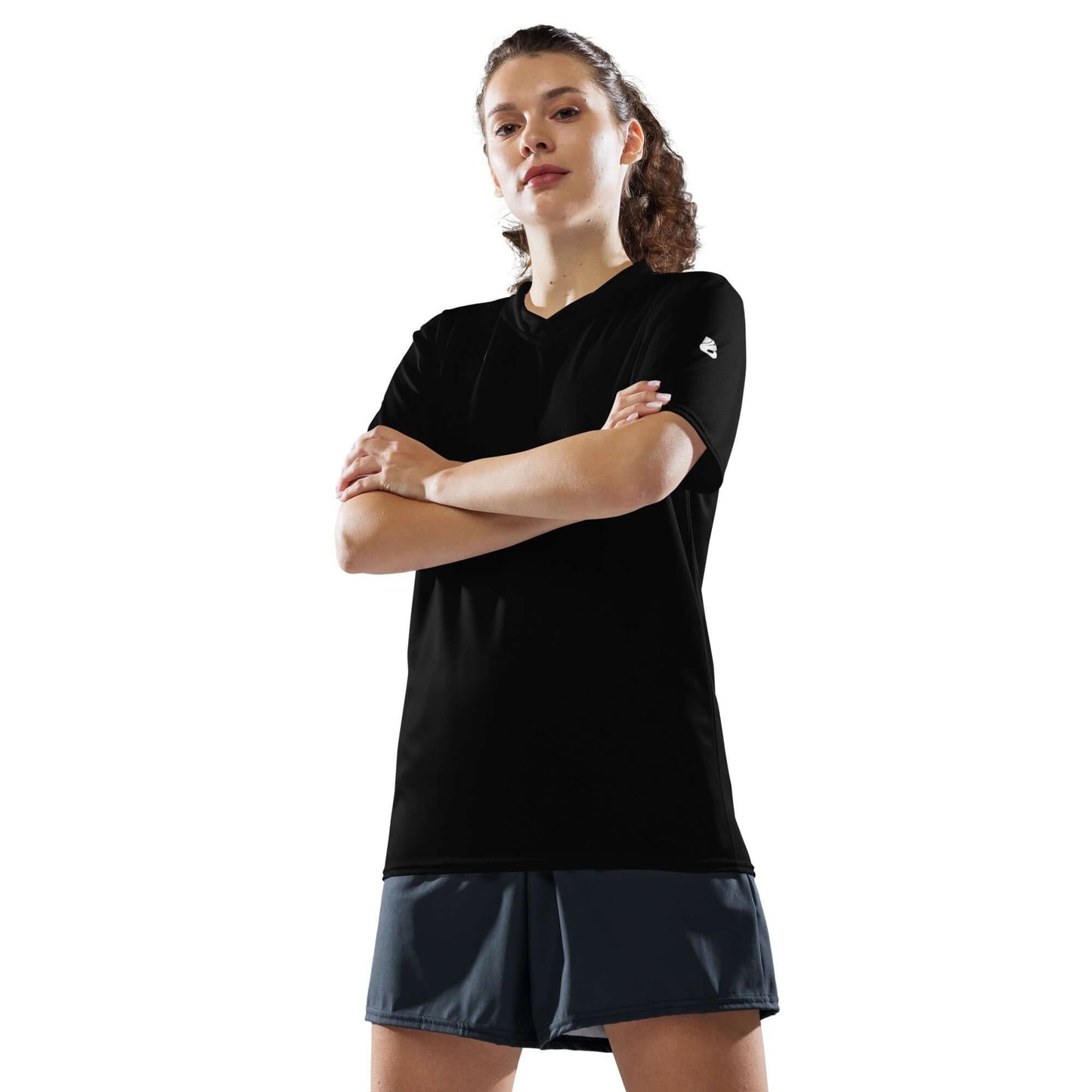 Person wearing Recyceltes Unisex-Trikot N°1, a black breathable sports jersey made from 100% recycled polyester, with a stylish V-neck.