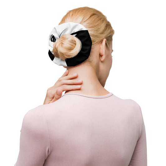 Woman showcasing Scrunchie N°0 in her hair, offering stylish and secure hold with black and white design.