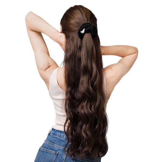 Woman wearing Scrunchie N°2 in long hair, trendy accessory for securing hair, made from soft stretchy fabric, perfect fashion addition.