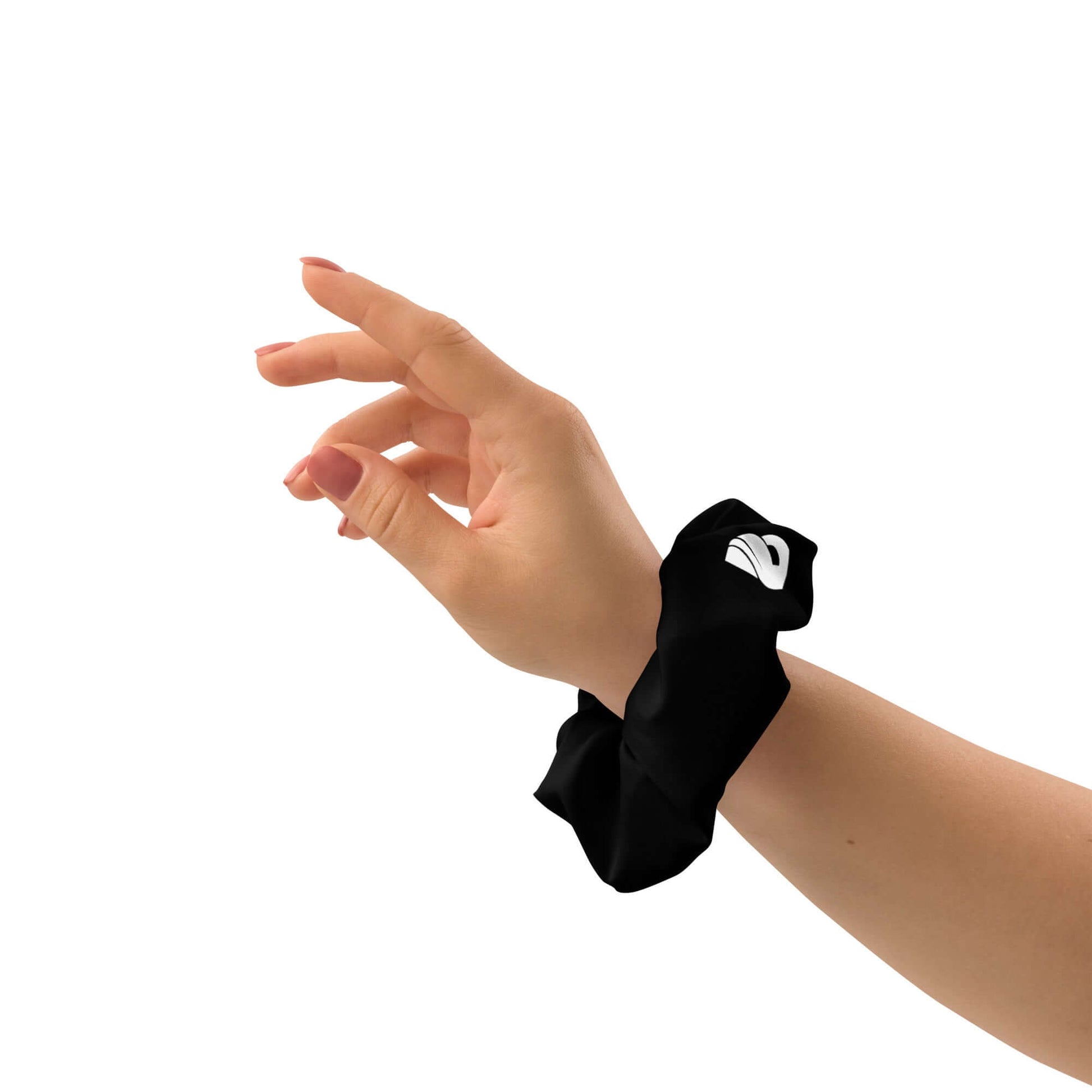 Hand wearing black Scrunchie N°2 with white logo, showcasing stylish and stretchy polyester accessory for hair support and fashion.